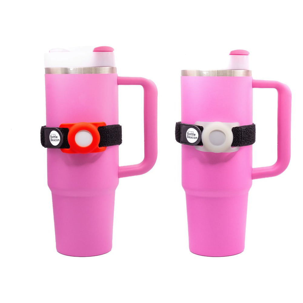 Red and Glow in the Dark Bottle Beacon straps on two pink Stanley tumblers